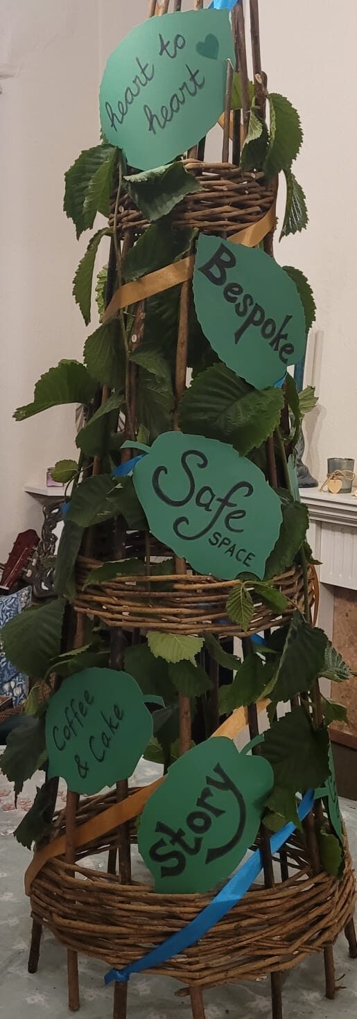 A tree with wordslike safe space on it